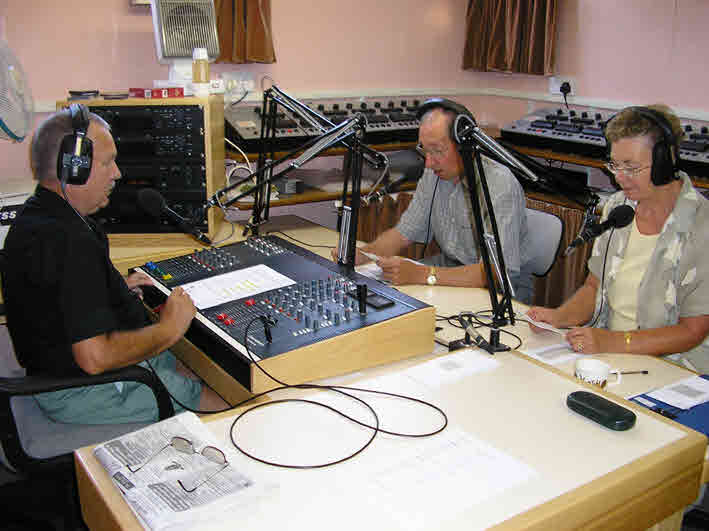 Another studio photo of the Presenter and two of our readers